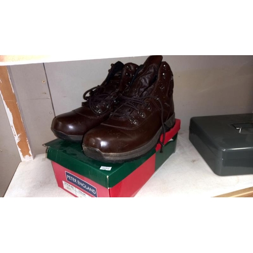 223 - A cash box with keys, drill bits, accessories, new window kit, work boots size 10 etc (2 shelves)