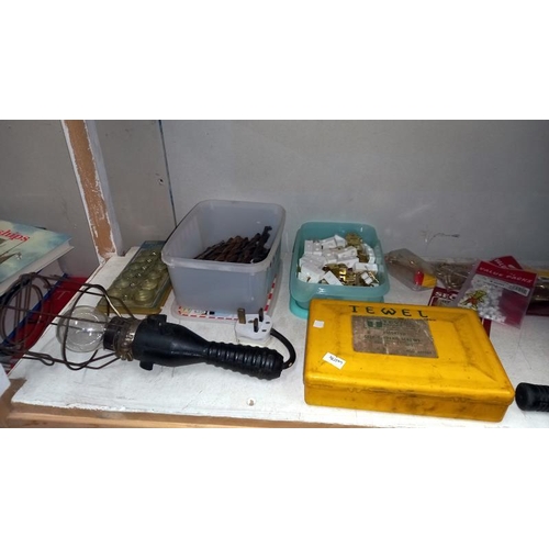 223 - A cash box with keys, drill bits, accessories, new window kit, work boots size 10 etc (2 shelves)