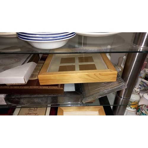 230 - A good selection of new & old stretched picture frames