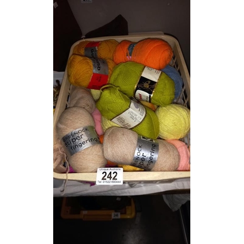 242 - A large quantity of tapestry threads and box of knitting wool