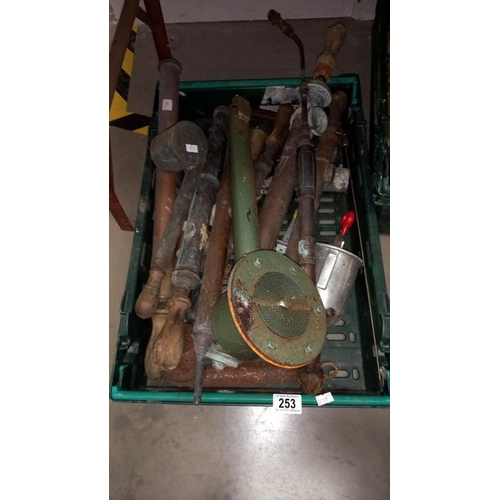 253 - A large quantity of vintage brass garden spray pumps