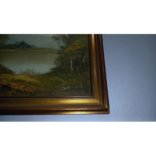 254 - A gilt framed oil on canvas of wooded lake signed Samuel