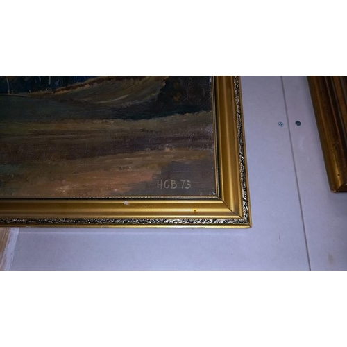 255 - A gilt framed oil on board signed HGB 73 of open land between trees.