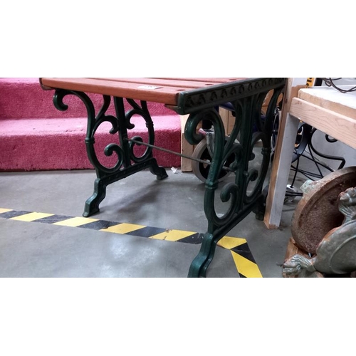 263 - A garden stool with cast iron legs