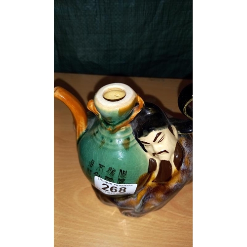 268 - A Chinese figural pottery teapot & a figure