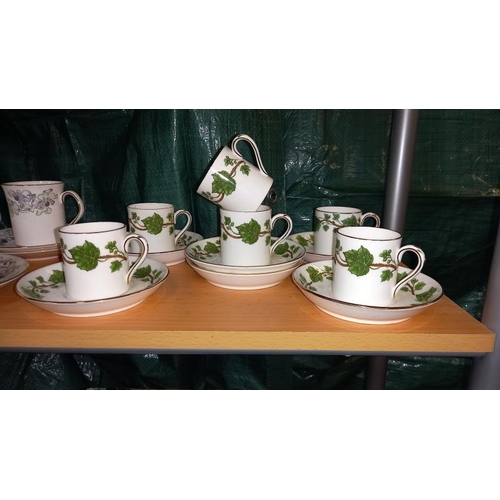 296 - An Elizabethan Anemone tea set designed by A Kusmirek on a Crown Staffordshire ivy pattern. tea sets