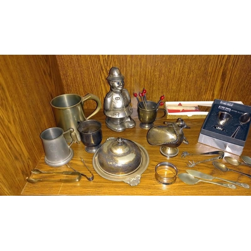 333 - A quantity of silver plated items including toast racks, butter dish and policeman money box etc.