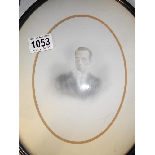 1053 - A pair of oval framed pictures