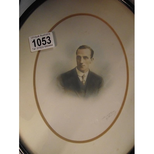 1053 - A pair of oval framed pictures