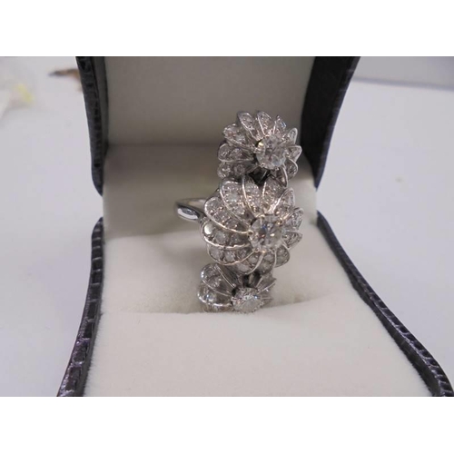 2030A - An 18ct white gold triple cluster diamond ring, size N, total weight 8 grams.