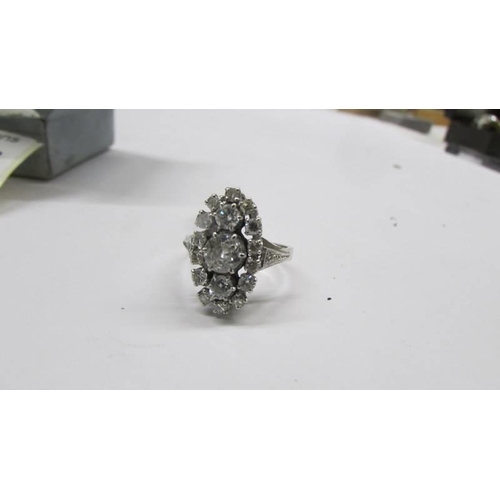 2030B - An 18ct white gold and diamond ring, size N, Total weight 5.2 grams.