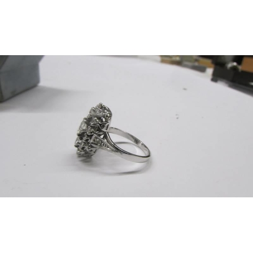 2030B - An 18ct white gold and diamond ring, size N, Total weight 5.2 grams.