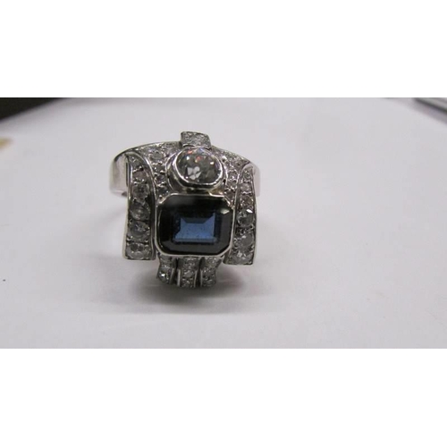 2030C - An 18ct white gold diamond and sapphire ring, size P, total weight 8.9 grams.