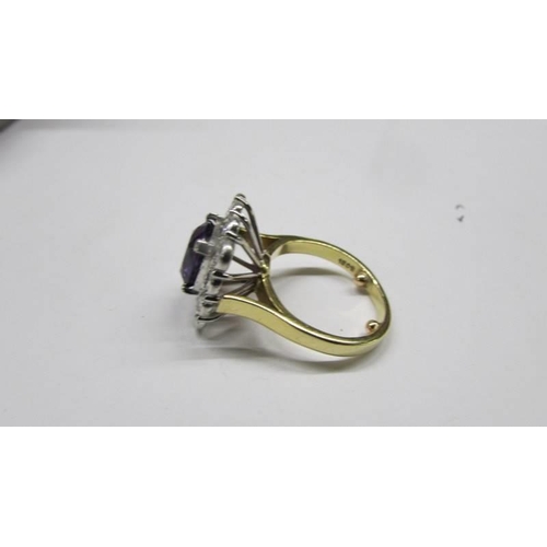 2030D - An 18ct gold amethyst and diamond ring, size J, total weight 8.2 grams.