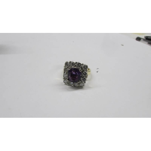 2030D - An 18ct gold amethyst and diamond ring, size J, total weight 8.2 grams.