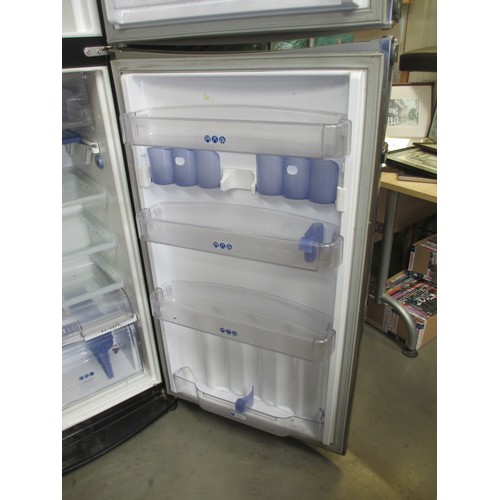 652 - A Whirlpool stainless steel fridge freezer