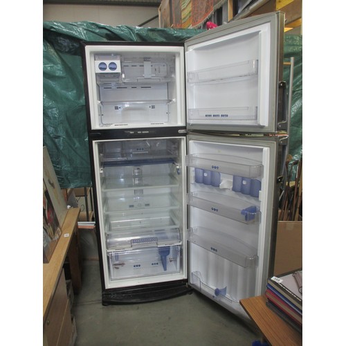 652 - A Whirlpool stainless steel fridge freezer