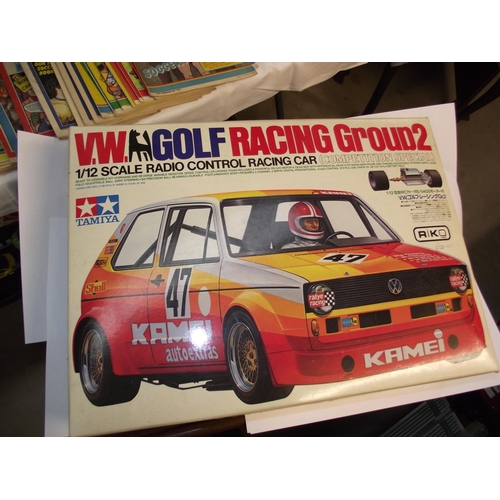 1147 - A boxed as new kit Tamiya 1/12 scale VW Golf racing group 2 r/c car and an as new boxed acoms ap-227... 