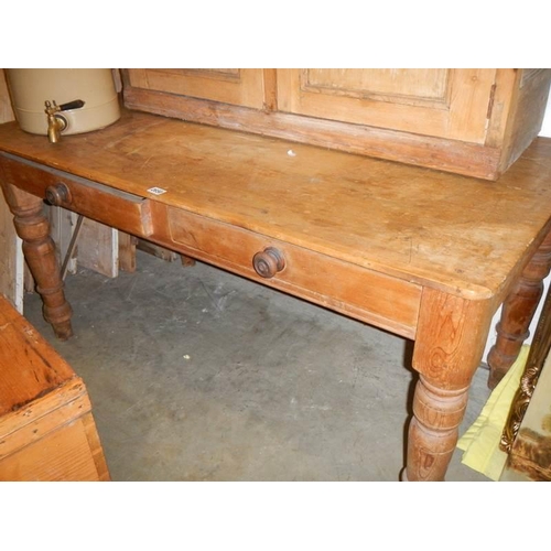 2650 - An antique pine two drawer scrub top table, COLLECT ONLY.