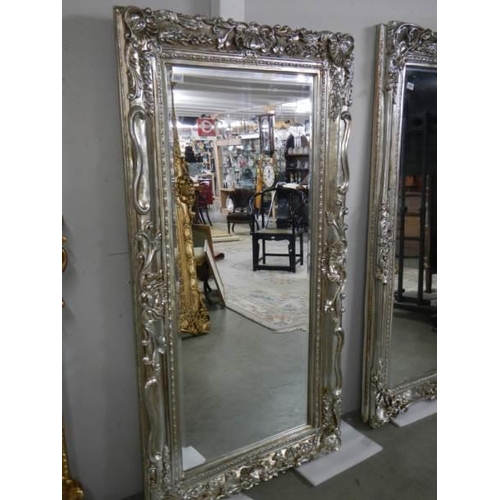 2657 - A large bevel edged mirror in gilded double swept frame, 92 x 176 cm. COLLECT ONLY.