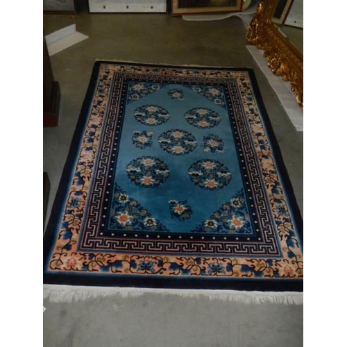 2690 - A vintage Persian blue wool rug, Approximately 128 x 178 cm, COLLECT ONLY.