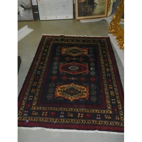 2691 - A vintage Persian red wool rug, Approximately 128 x 178 cm, COLLECT ONLY.