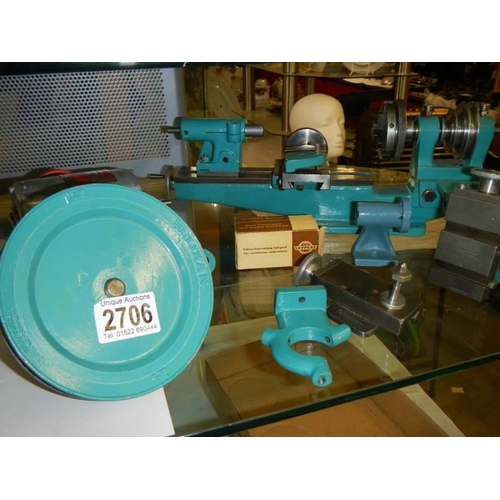 A Watchmakers lathe with crossslide, vertical mill attachment, chuck