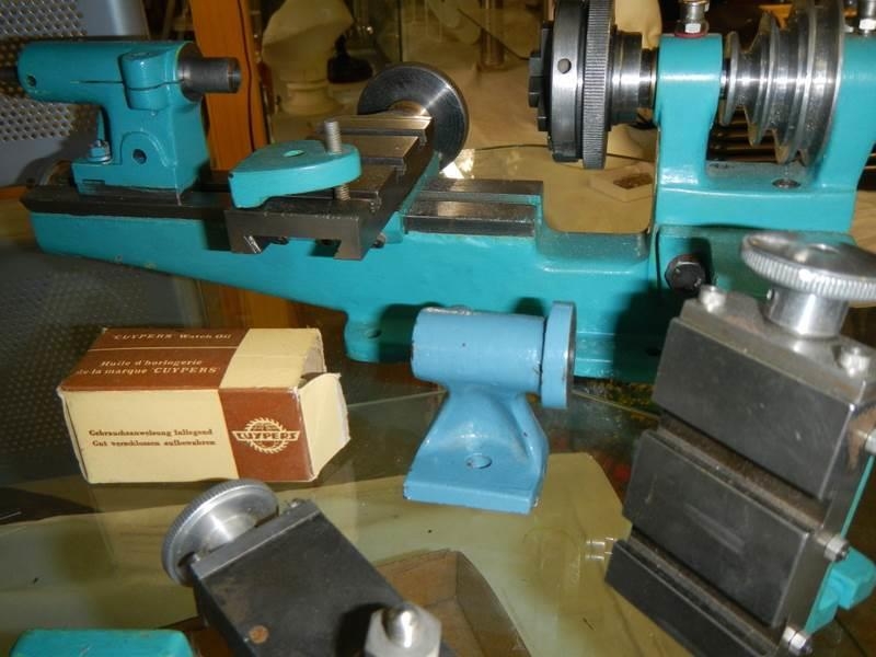 A Watchmakers lathe with crossslide, vertical mill attachment, chuck