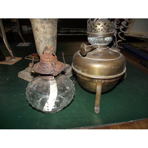 1253 - 2 wrought iron framed oil lamps with brass fonts and 1 other