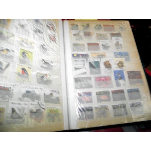 1255 - A mixed lot of stamps including albums, GPO postcards, mint definitives, kiloware etc