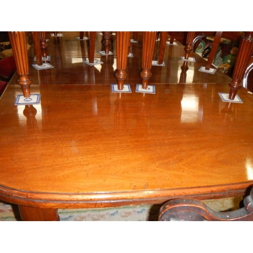 2857 - A Victorian mahogany wind out dining table and a set of twelve later mahogany dining chairs, COLLECT... 