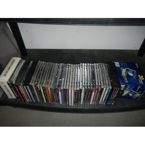 24 - Five shelves of CD's and DVD's, COLLECT ONLY.