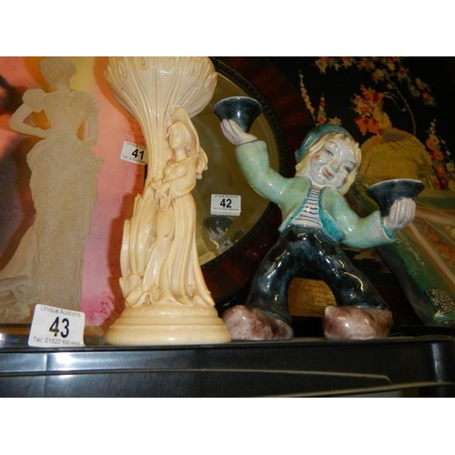 43 - A pair of boy/girl candleholders and other figures.