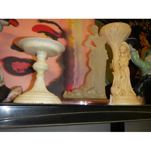 43 - A pair of boy/girl candleholders and other figures.