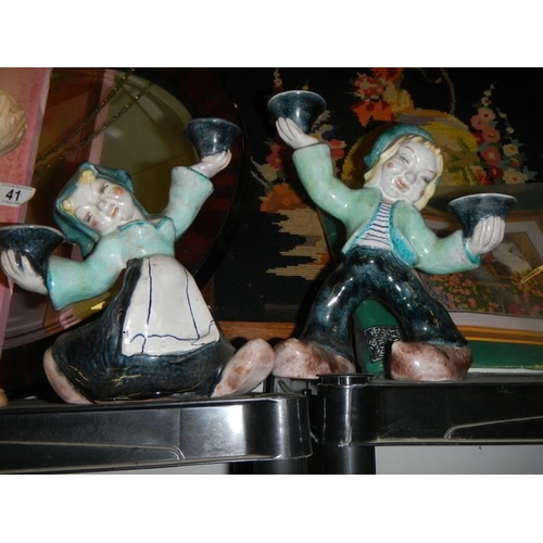 43 - A pair of boy/girl candleholders and other figures.