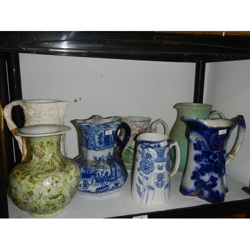 49 - A mixed lot of jugs including blue and white, COLLECT ONLY.