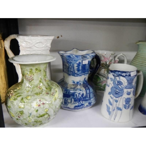 49 - A mixed lot of jugs including blue and white, COLLECT ONLY.