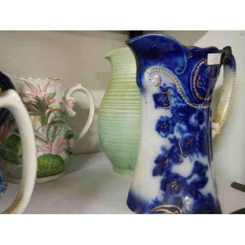 49 - A mixed lot of jugs including blue and white, COLLECT ONLY.