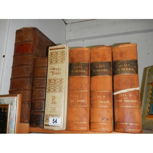 54 - Three volumes of Scott on the Bible, a family Bible and other Bibles.