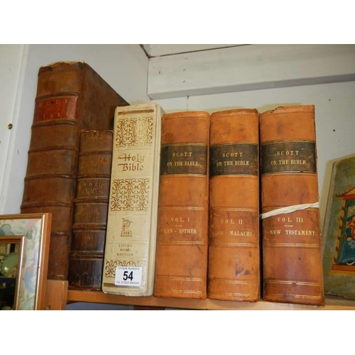 54 - Three volumes of Scott on the Bible, a family Bible and other Bibles.