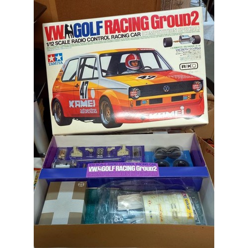 1147 - A boxed as new kit Tamiya 1/12 scale VW Golf racing group 2 r/c car and an as new boxed acoms ap-227... 