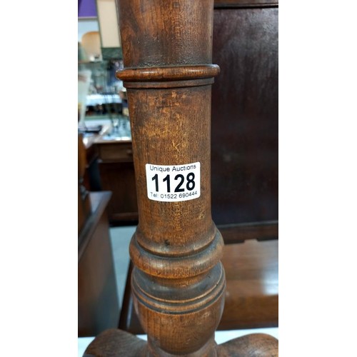 1128 - A 19th century oak pub/cricket table on centre column tripod base, top diameter 56cm, height 72cm CO... 