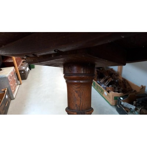 1128 - A 19th century oak pub/cricket table on centre column tripod base, top diameter 56cm, height 72cm CO... 