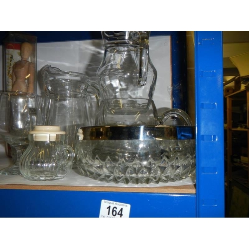 164 - A quantity of glass jugs etc., COLLECT ONLY.