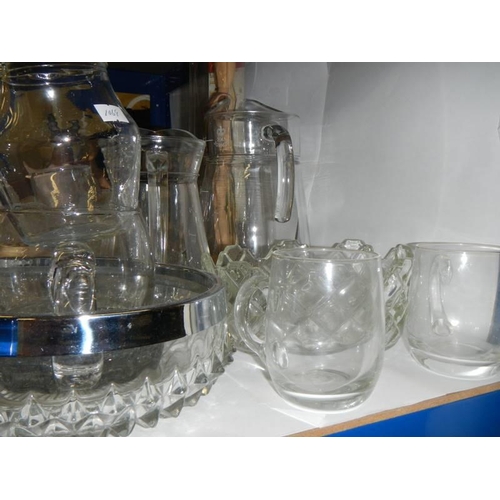 164 - A quantity of glass jugs etc., COLLECT ONLY.