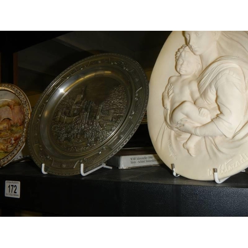 172 - Two collector's plates, a metal plate and a Madonna with child plaque.