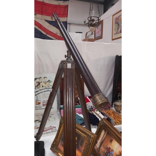 1372 - A leather bound brass telescope on tripod stand COLLECT ONLY