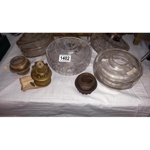 1402 - 4 glass oil lamp fonts and various burners a/f