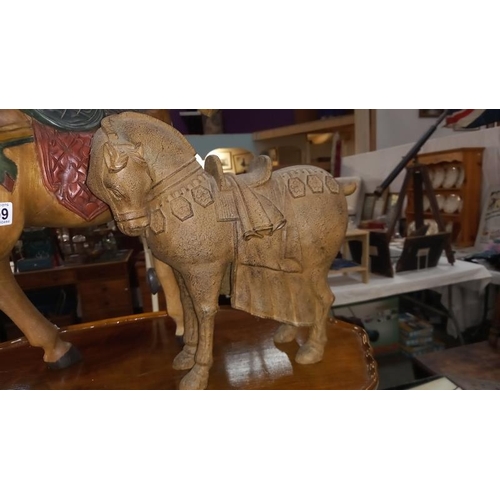 1409 - A painted teak horse height 57cm and a resin tang style horse height 34cm COLLECT ONLY