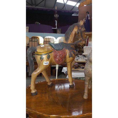 1409 - A painted teak horse height 57cm and a resin tang style horse height 34cm COLLECT ONLY